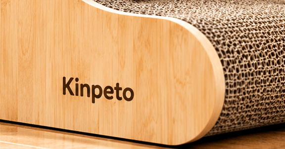 Close-up of a Kinpeto wooden cat scratcher with natural texture.
